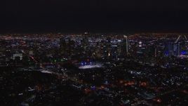 HD stock footage aerial video of flying by the city's skyline at night in Downtown Los Angeles, California Aerial Stock Footage | CAP_018_170