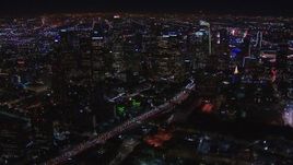 HD stock footage aerial video of passing by the city's skyline at night in Downtown Los Angeles, California Aerial Stock Footage | CAP_018_172