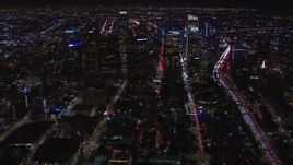 HD stock footage aerial video of flying past the city's skyline at night in Downtown Los Angeles, California Aerial Stock Footage | CAP_018_173