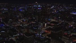 HD stock footage aerial video of flying away from and past city hall and the city's skyline at night in Downtown Los Angeles, California Aerial Stock Footage | CAP_018_175