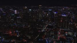 HD stock footage aerial video of flying by the city's skyline at night in Downtown Los Angeles, California Aerial Stock Footage | CAP_018_177