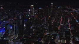 HD stock footage aerial video flyby the city's skyline at night to reveal Staples Center, Downtown Los Angeles, California Aerial Stock Footage | CAP_018_183