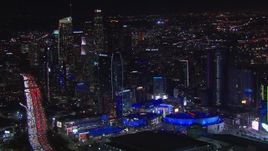 HD stock footage aerial video of Staples Center and the city's skyline at night, Downtown Los Angeles, California Aerial Stock Footage | CAP_018_186