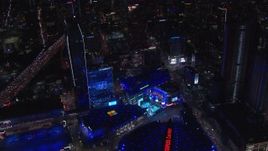 HD stock footage aerial video orbit ice skating rink and Christmas tree by theater at night, Downtown Los Angeles, California Aerial Stock Footage | CAP_018_194