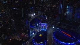 HD stock footage aerial video orbit ice skating rink by theater and Ritz-Carlton at night, Downtown Los Angeles, California Aerial Stock Footage | CAP_018_195