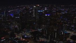 HD stock footage aerial video of flying past tall skyscrapers at night, Downtown Los Angeles, California Aerial Stock Footage | CAP_018_209