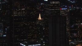 HD stock footage aerial video of flying by skyscrapers at night to reveal holiday decorations, Downtown Los Angeles, California Aerial Stock Footage | CAP_018_212