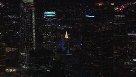 HD stock footage aerial video of zoom from rooftop Christmas tree to reveal skyscrapers, Downtown Los Angeles, California Aerial Stock Footage | CAP_018_213