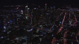 HD stock footage aerial video of zoom to wide view of skyline at night, Downtown Los Angeles, California Aerial Stock Footage | CAP_018_214