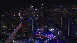 HD stock footage aerial video wide view of skyline at night, seen from Staples Center, Downtown Los Angeles, California Aerial Stock Footage | CAP_018_216