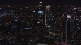HD stock footage aerial video flying by Wilshire Grand Center and skyline at night, Downtown Los Angeles, California Aerial Stock Footage | CAP_018_218
