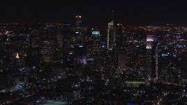 HD stock footage aerial video zooming to wider view of skyline at night, Downtown Los Angeles, California Aerial Stock Footage | CAP_018_219
