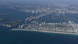 HD stock footage aerial video of approaching South Beach near the port and Downtown Miami, Florida Aerial Stock Footage | CAP_020_010