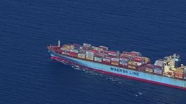 HD stock footage aerial video zoom out while tracking a cargo ship near Miami Beach, Florida Aerial Stock Footage | CAP_020_020