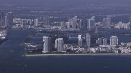 HD stock footage aerial video of flying by South Beach high-rises on the coast, Florida Aerial Stock Footage | CAP_020_022