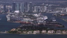 HD stock footage aerial video of a view of Fisher Island, Port of Miami and downtown skyline, Florida Aerial Stock Footage | CAP_020_027