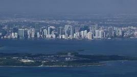 HD stock footage aerial video zoom to a closer view of the Downtown Miami skyline across Biscayne Bay, Florida Aerial Stock Footage | CAP_020_029
