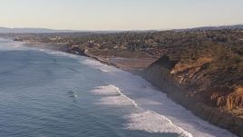 HD stock footage aerial video of flying by coastal cliffs toward road and lagoon, Torrey Pines, California Aerial Stock Footage | CAP_021_002