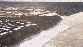 HD stock footage aerial video fly away from coastal cliffs, neighborhoods and apartment buildings, Del Mar, California Aerial Stock Footage | CAP_021_009