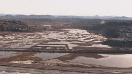 HD stock footage aerial video flying by marshlands and coastal highway, Encinitas, California Aerial Stock Footage | CAP_021_010