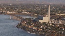 HD stock footage aerial video of flying toward the power plant in Carlsbad, California Aerial Stock Footage | CAP_021_015