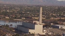 HD stock footage aerial video of orbiting the power plant smoke stack in Carlsbad, California Aerial Stock Footage | CAP_021_016