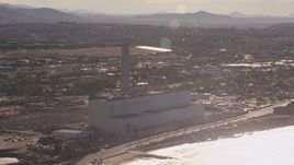 HD stock footage aerial video of flying away from the power plant and smoke stack in Carlsbad, California Aerial Stock Footage | CAP_021_018