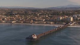 HD stock footage aerial video of circling Oceanside Pier with view of the community of Oceanside, California Aerial Stock Footage | CAP_021_024
