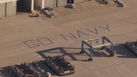 HD stock footage aerial video of "Go Navy" by military craft at Camp Pendleton South, California Aerial Stock Footage | CAP_021_032