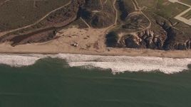 HD stock footage aerial video of flying by an empty strip of beach on the coast, Oceanside, California Aerial Stock Footage | CAP_021_037