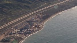 HD stock footage aerial video of a reverse view of the San Onofre Nuclear Power Plant on the coast, California Aerial Stock Footage | CAP_021_051