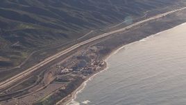 HD stock footage aerial video of flying away from the San Onofre Nuclear Power Plant beside the ocean, California Aerial Stock Footage | CAP_021_053