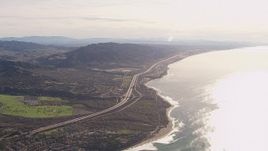 HD stock footage aerial video of flying away from I-5 by coastal neighborhoods in San Clemente, California Aerial Stock Footage | CAP_021_054