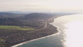 HD stock footage aerial video of a reverse view of I-5 by coastal neighborhoods in San Clemente, California Aerial Stock Footage | CAP_021_055