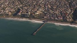 HD stock footage aerial video of orbiting a pier by coastal neighborhoods in San Clemente, California Aerial Stock Footage | CAP_021_056