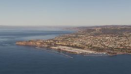 HD stock footage aerial video of approaching the harbor and coastal neighborhoods in Dana Point, California Aerial Stock Footage | CAP_021_059