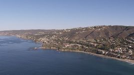 HD stock footage aerial video approach hillside homes and coastal neighborhoods in Laguna Beach, California Aerial Stock Footage | CAP_021_067