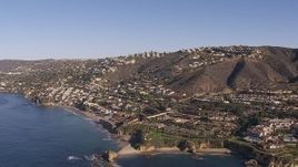 HD stock footage aerial video flying by hillside homes and coastal neighborhoods in Laguna Beach, California Aerial Stock Footage | CAP_021_068