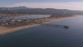 HD stock footage aerial video fly away from pier by the beach and coastal neighborhoods, Newport Beach, California Aerial Stock Footage | CAP_021_078
