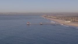 HD stock footage aerial video of approaching a diner on a pier, Huntington Beach, California Aerial Stock Footage | CAP_021_080