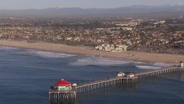 HD stock footage aerial video of orbiting a diner on a pier, Huntington Beach, California Aerial Stock Footage | CAP_021_082