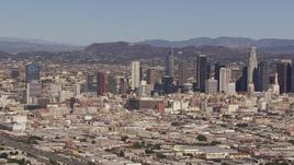 HD stock footage aerial video of flying toward the city's skyline and Hollywood Sign, Downtown Los Angeles, California Aerial Stock Footage | CAP_021_090