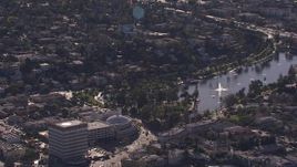 HD stock footage aerial video of flying away from an office building, reveal lake in Echo Park, Los Angeles, California Aerial Stock Footage | CAP_021_115