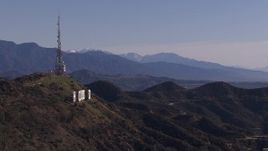 HD stock footage aerial video of the famous Hollywood Sign and distant mountains, Los Angeles, California Aerial Stock Footage | CAP_021_121