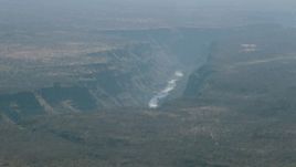 HD stock footage aerial video of passing by a river in a deep canyon near Victoria Falls, Zimbabwe Aerial Stock Footage | CAP_026_006