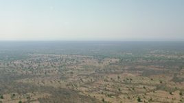HD stock footage aerial video of a wide view across open savanna, Zimbabwe Aerial Stock Footage | CAP_026_010