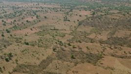 HD stock footage aerial video of flying above open savanna, Zimbabwe Aerial Stock Footage | CAP_026_011