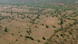 HD stock footage aerial video of a view of trees in open savanna, Zimbabwe Aerial Stock Footage | CAP_026_012