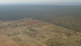 HD stock footage aerial video of an approach to open savanna, Zimbabwe Aerial Stock Footage | CAP_026_016