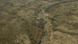 HD stock footage aerial video of tilting to a dry riverbed in the savanna, Zimbabwe Aerial Stock Footage | CAP_026_022